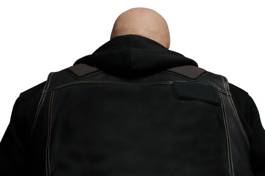 The bald person in a black jacket with a hood