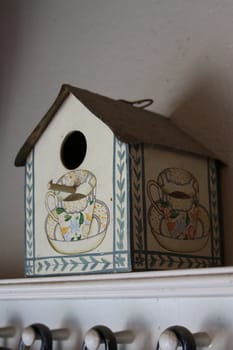 Close up of a small bird house.