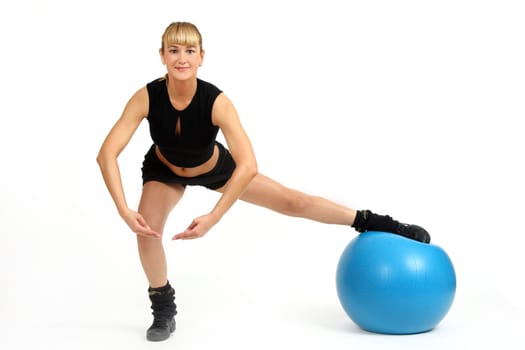 The girl, the instructor shows different exercises