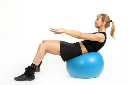 The girl, the instructor shows different exercises