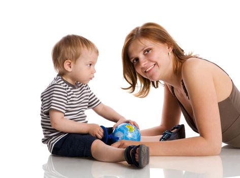 Happy mother holding globe with son isolated on white