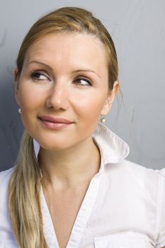 Portrait of young beautiful happy thinking woman