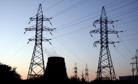 Power station over orange and blue sky