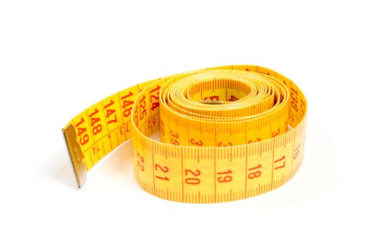 Curled yellow measuring tape on white background