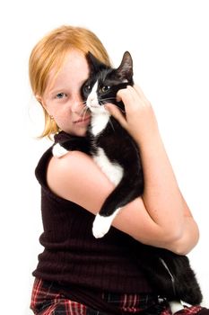 girl is cuddling with a young cat isolated on white