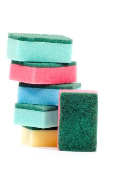 stack of colorful cleaning sponges isolated on a white background