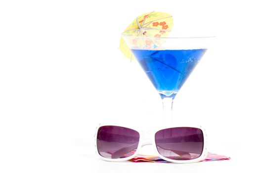cocktail on napkin with sunglasses  on white