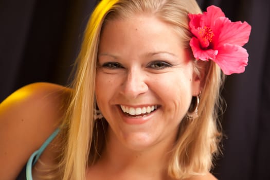 Beautiful Smiling Girl with Hibiscus Flower in Her Hair.