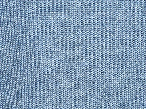 The photo shows a fragment of a wool sweater blue