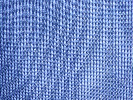 The photo shows a fragment of a wool sweater blue