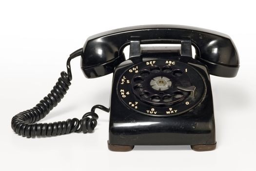 Image of an old beatup rotary telephone.