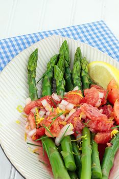 Freshly picked asparagus steamed and served with a tomato and raspberry vinaigrette.