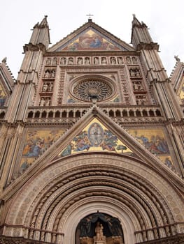 Front view of the mosaics of the gothic cathedral of Orvieto in Umbria, Italy.