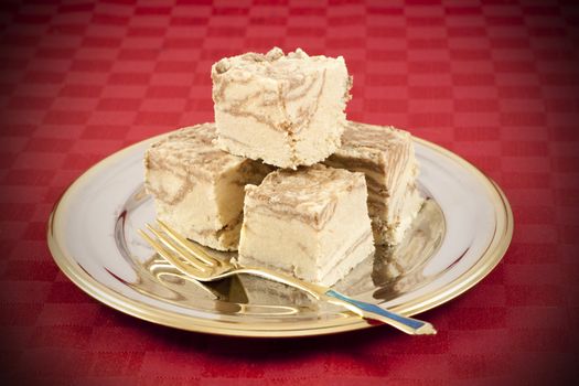 Delicious Halva served in silver-golden dish. Vignetting effect applied.