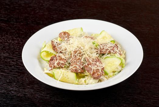 Salad with beef, lettuce, cucumber, string beans, Chinese cabbage and sauce