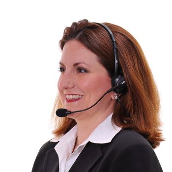 Angle shot of a pretty woman wearing headset smiling - over a white background.