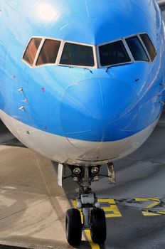 Air transportation: Close-up of a passenger airliner approaching its gate.