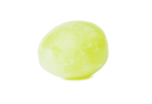 A single green grape over white background