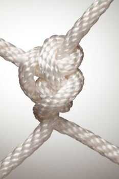 Nylon Rope Knot on a Spot Lit Background.