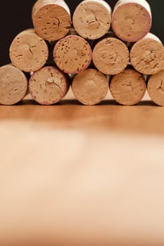 Stack of Wine Corks on a Wood Surface.