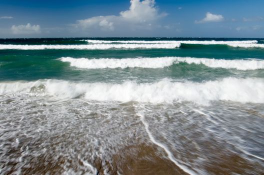 It is a beautiful beach with big waves in Taiwan.