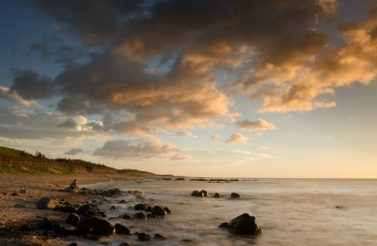 It is sunset of beautiful coral reef coastline.