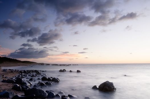 It is sunset of beautiful coral reef coastline.