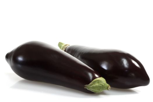 Two fresh eggplants on white background