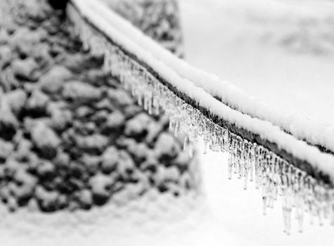 Closeup picture of some icecles on a rope after an icestorm