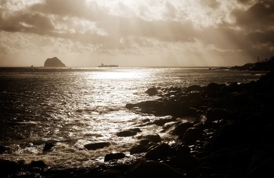 Here is a boat on the sea with strong light effect.