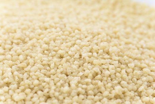 Macro (close-up) of couscous grain filling whole frame.