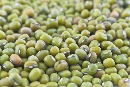 Macro (close-up) of green mung beans filling whole frame.