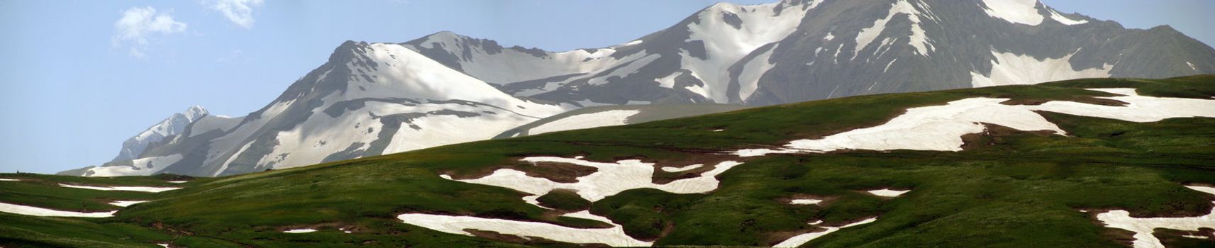 Mountains; rocks; a relief; a landscape; a hill; a panorama; Caucasus; top; a slope; a snow