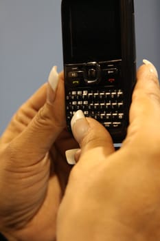 Close up of woman's hand holding Cell Phone.