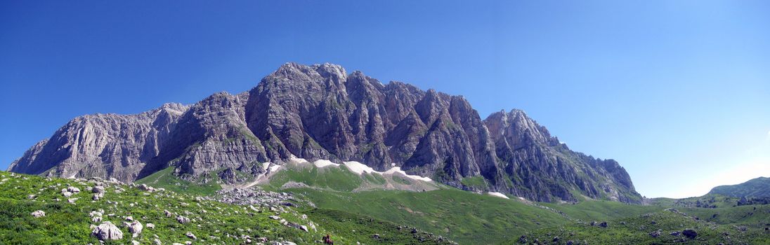 Mountains; rocks; a relief; a landscape; a hill; a panorama; Caucasus; top; a slope; a snow