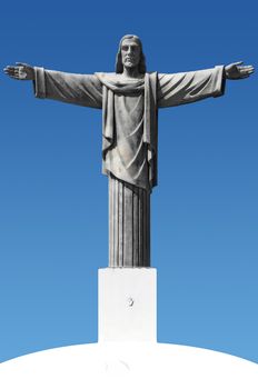 Statue of Jesus Christ with impressed child's hand on the pedestal