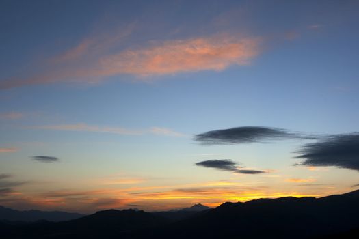 sunset scenic of a mountain range in the nature