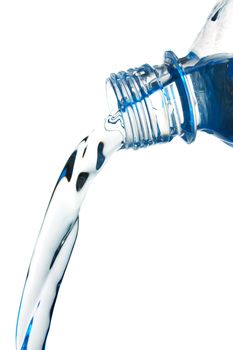 stream of water flows from the bottle Isolated on white background