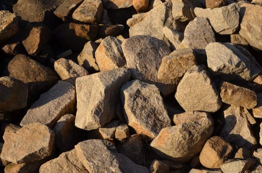 Late afternoon sun casting shadows on the rocks on the Brisbane River bank at Kangaroo Point.