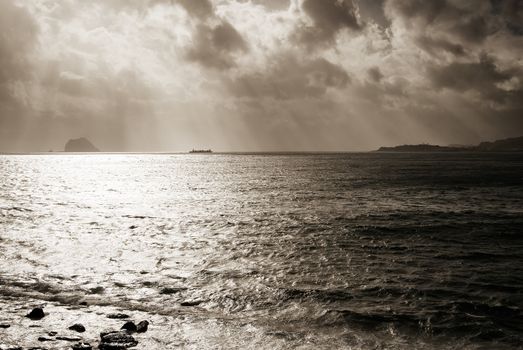 Here is a boat on the sea with strong light effect.