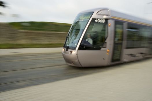 Laus Tram travelling at high speed in Dublin