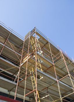 Scaffold on new building shot from below