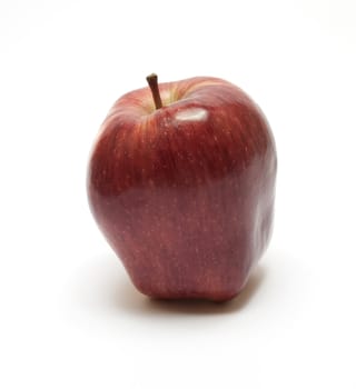 Single red fresh apple over white background