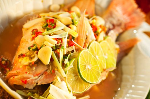 Thai food - Red snapper with garlic, chili, lemon grass and lemon