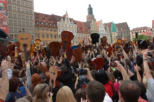 WROCLAW, POLAND - April 30: Guitars World Guinness Record, 5601 participants gather in front of Wroclaw's Town Hall on April 30, 2011 to beat guitar mass participation record.  