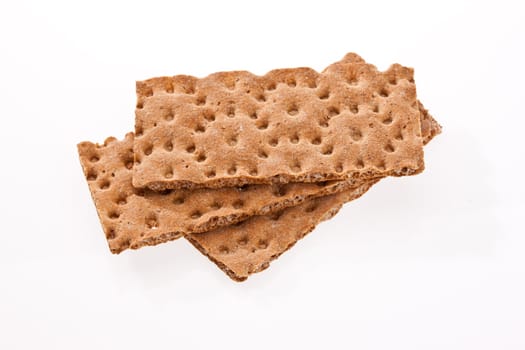 Pieces of dry bread crackers on a white background