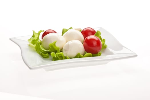 food series: mozzarella, tomato and lettuce over white