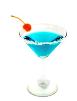An electric blue cocktail with a passionfruit cherry.