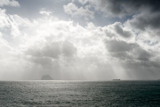 Here is a boat on the sea with strong light effect.