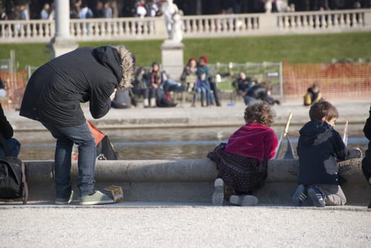 kids in the park near a fountain